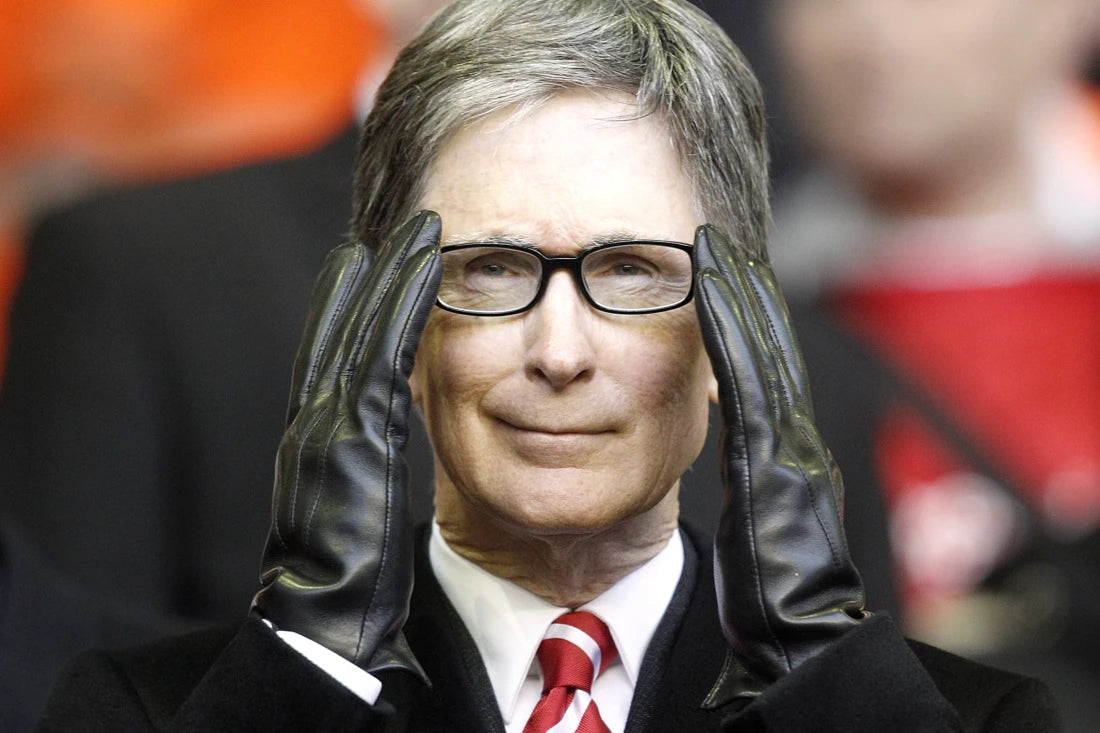 Person wearing glasses and black gloves with a blurred background